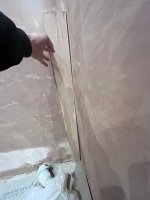 Straightening wall before tiling