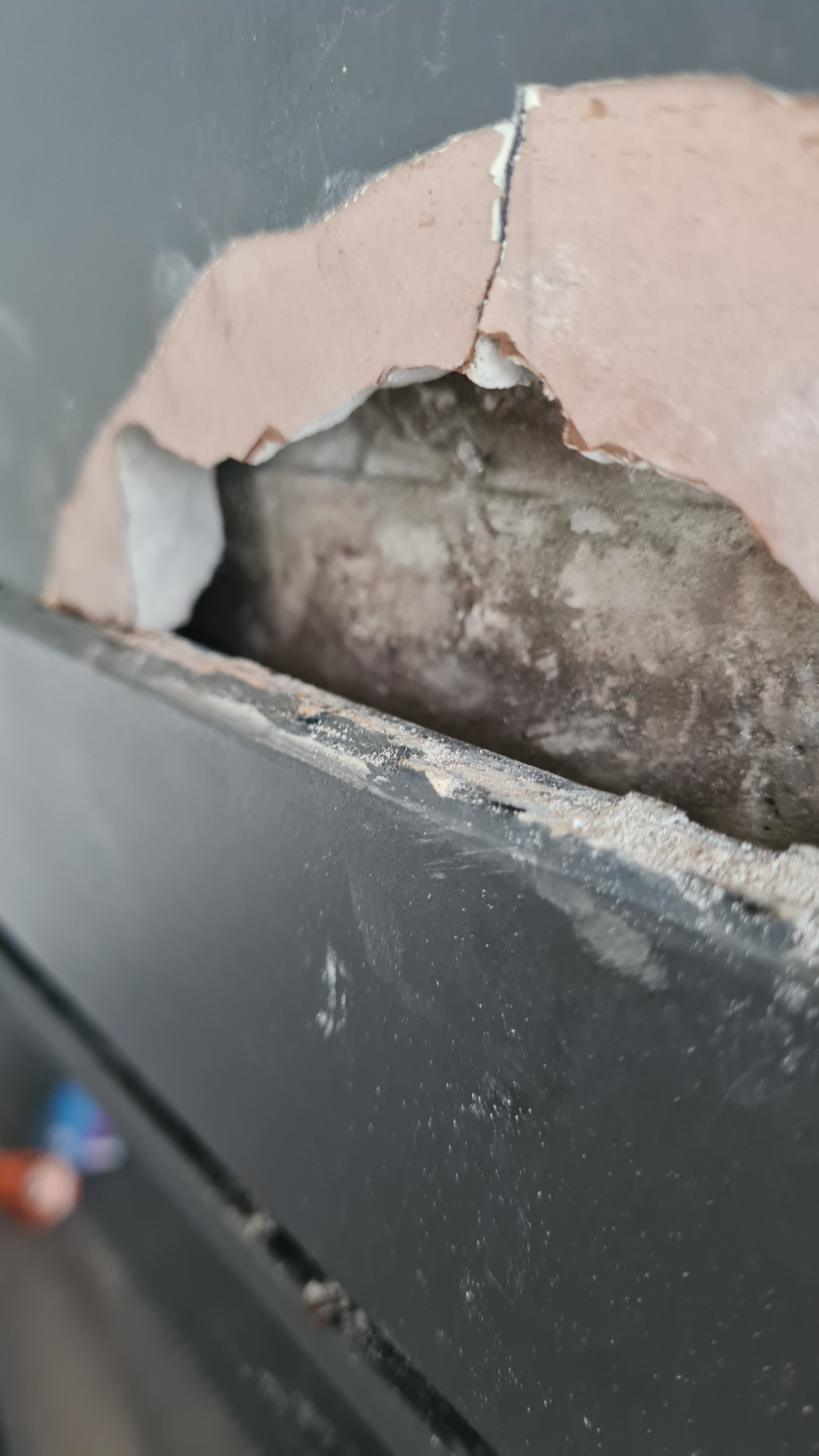 Inset stove plaster peeling and cracked plasterboard