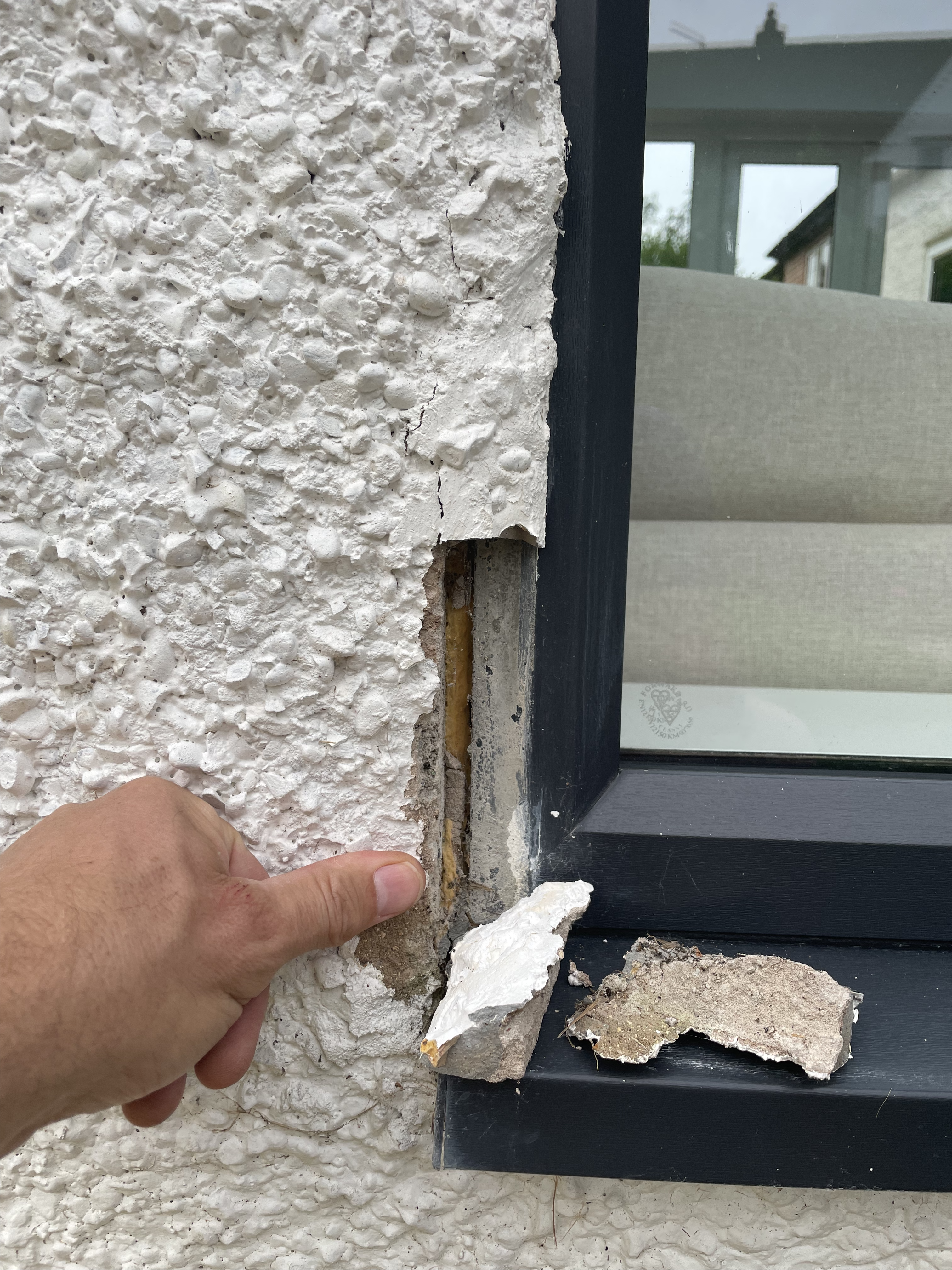 Don't look - Horror Story - Roughcast falling off around UPVC windows