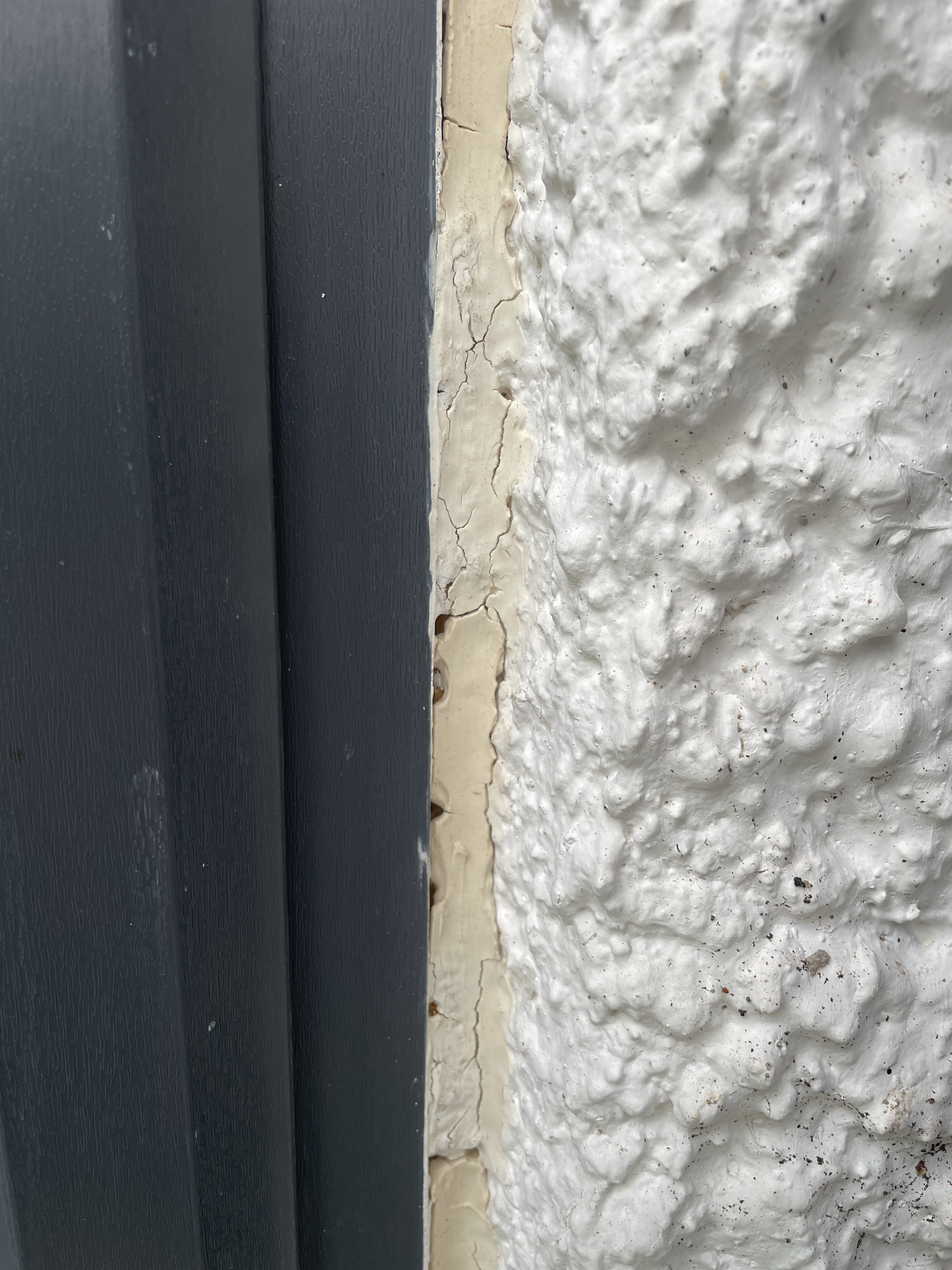 Don't look - Horror Story - Roughcast falling off around UPVC windows