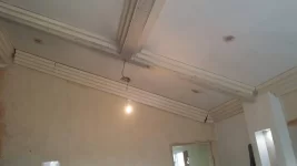 Art deco cornice and a sloped ceiling