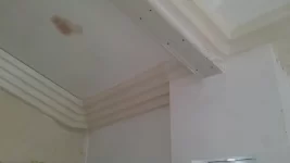 Art deco cornice and a sloped ceiling