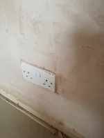 Should plasterer have removed socket/switch covers?