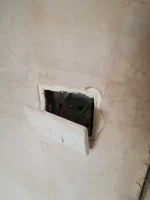 Should plasterer have removed socket/switch covers?