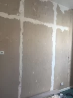 Skimming over torn plasterboard paper