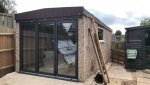 Rendering over pebbledash garage