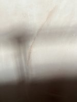 My plasterer skimmed OVER wallpaper - HELP
