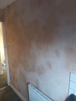 After advice on why finished plaster often has white patches that feel dusty to the touch